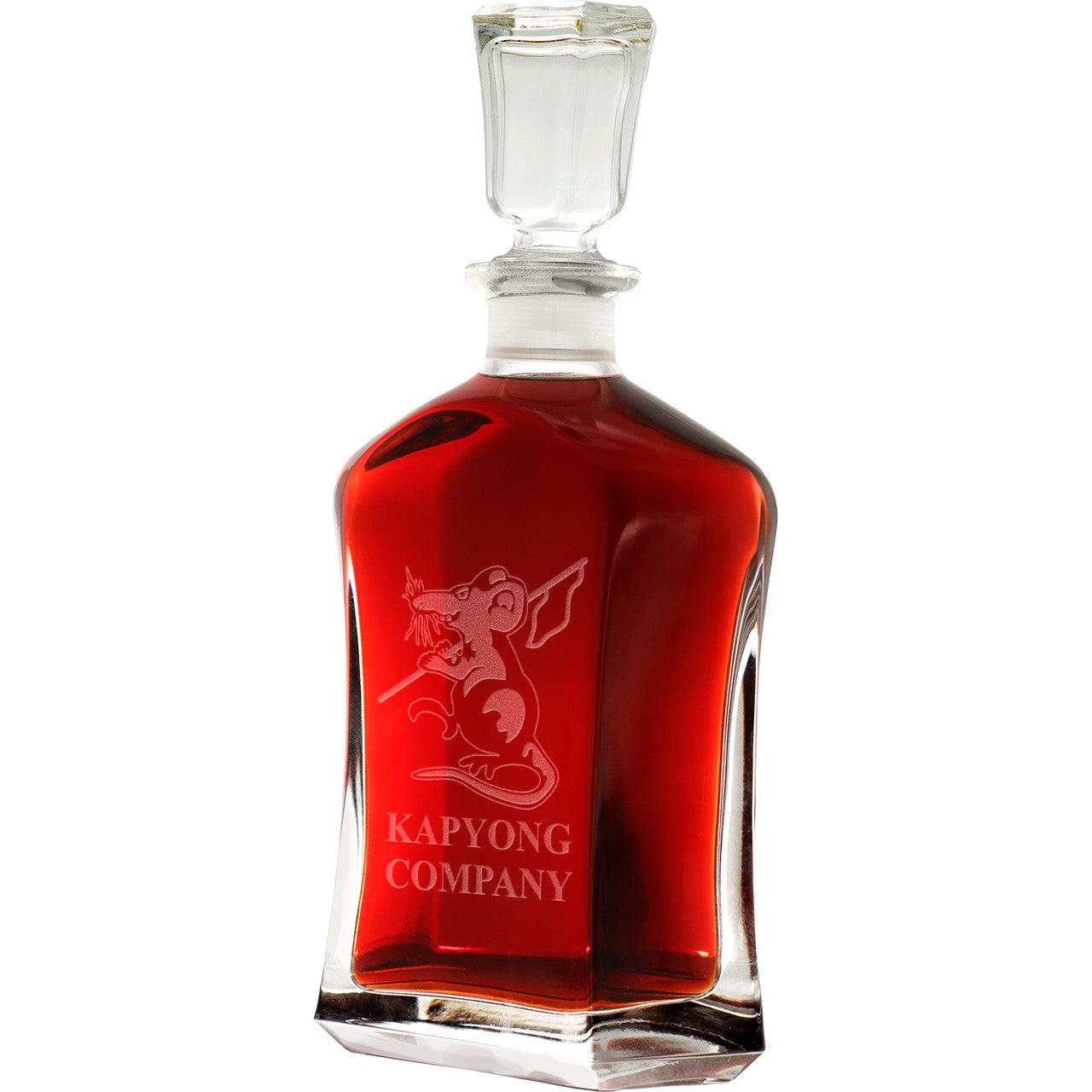 Bring your dining experience to life with the Kapyong Company Italian Glass Decanter. This elegant, 750ml decanter proudly displays the company crest, etched with precision onto the sleek glass surface. Perfect for gifting or displaying in your own cabinet or bar, this decanter is a must-have for any wine or spirit enthusiast. Enhance your evening with the beauty and quality of this stunning piece. www.moralepatches.com.au
