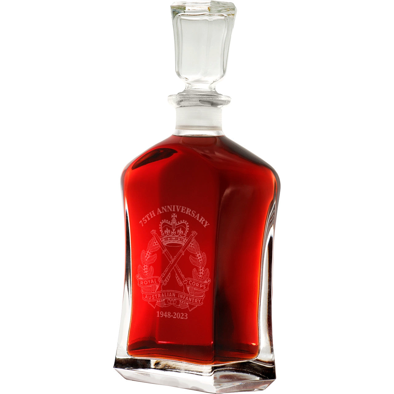 Bring your dining experience to life with the Rainf 75th Italian Glass Decanter. This elegant, 750ml decanter proudly displays the company crest, etched with precision onto the sleek glass surface. Perfect for gifting or displaying in your own cabinet or bar, this decanter is a must-have for any wine or spirit enthusiast. Enhance your evening with the beauty and quality of this stunning piece. www.moralepatches.com.au