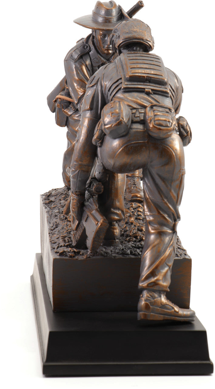 The "Spirit of Mateship Limited Edition Figurine" is a poignant and timeless tribute that captures the unwavering bond and camaraderie of Australian soldiers across generations. This exquisite cold cast bronze figurine, perched atop a timber base, depicts a powerful scene—a WW1 digger extending a helping hand to a modern Australian soldier, navigating a treacherous and muddy battlefield. www.moralepatches.com.au