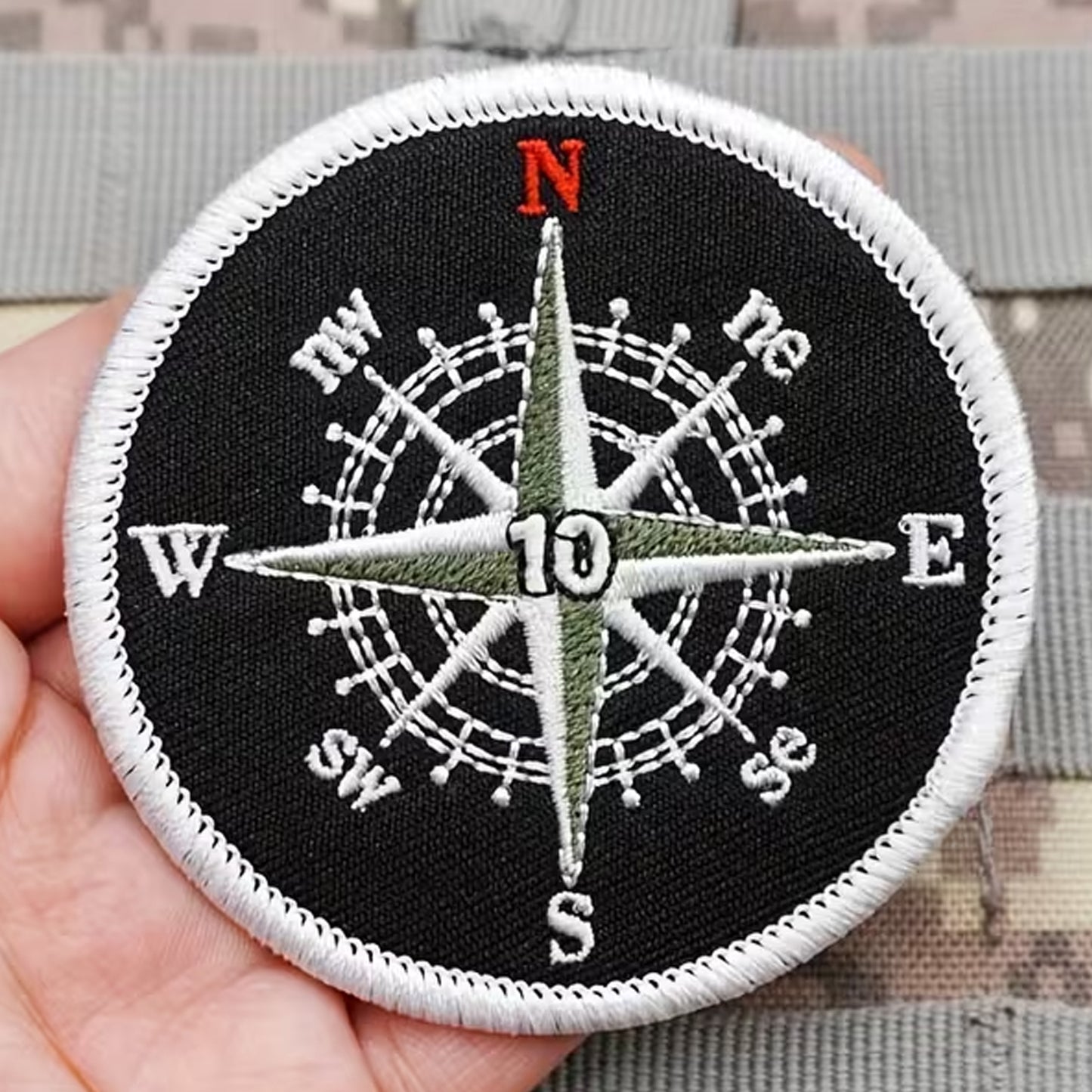 Unleash your creativity with the Compass Black & White Embroidery Patch Hook & Loop! Measuring 7.2cm and featuring a beautifully embroidered design and secure hook & loop backing, this patch is a must-have for any collector. www.moralepatches.com.au