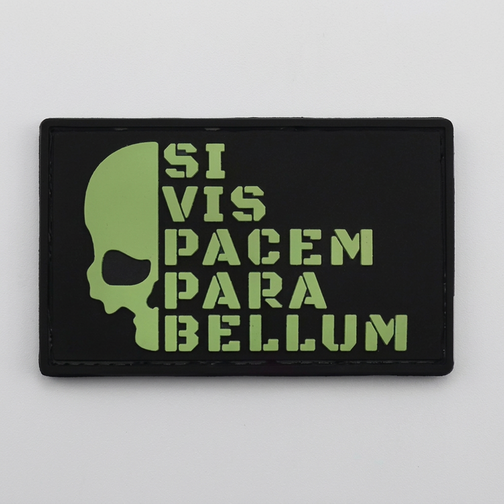 Black Para Bellum PVC patch with green skull and lettering on grey studio background