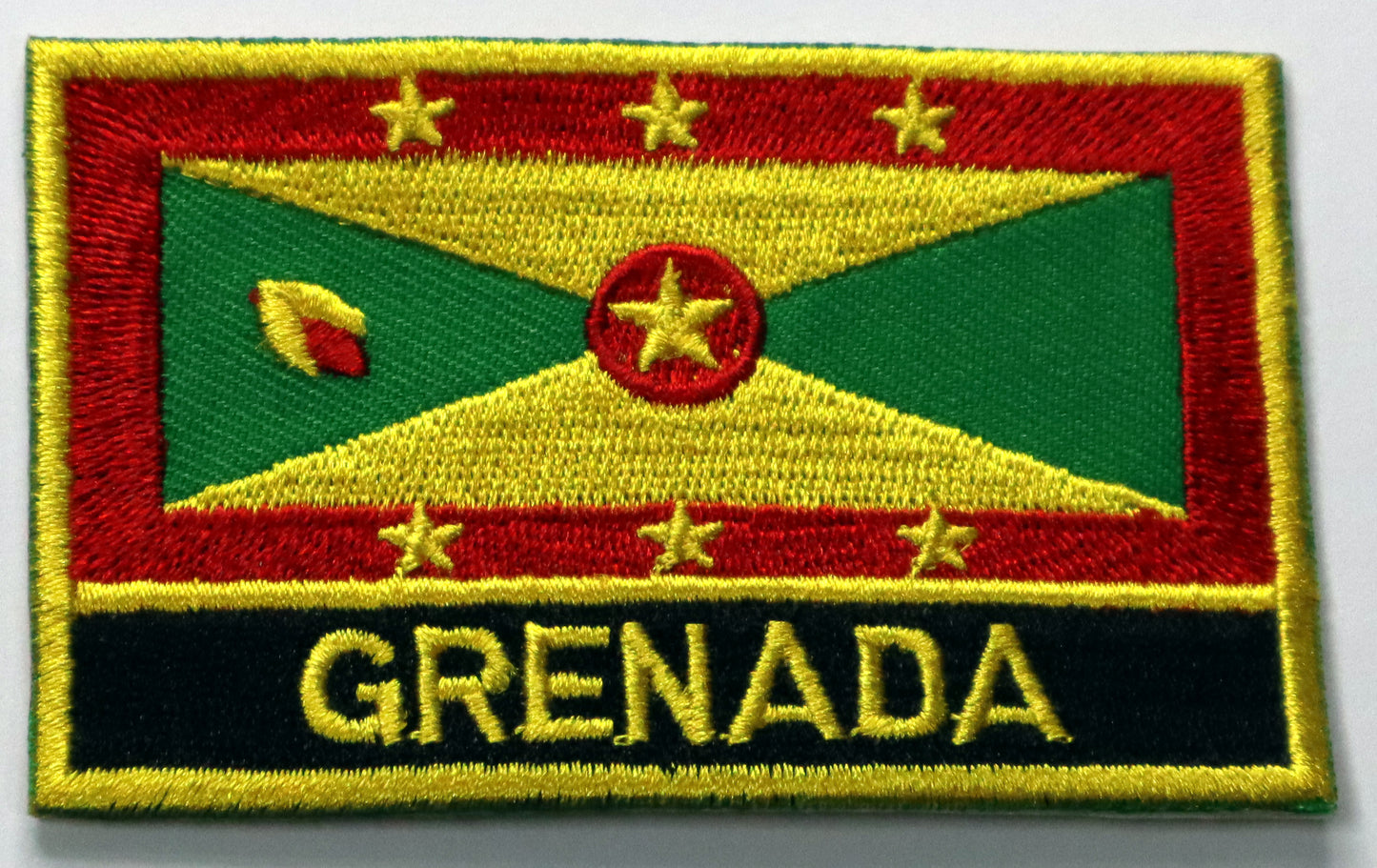 Grenada Flag Iron On Patch. Great for attaching to your jackets, shirts, pants, jeans, hats. Size: 8x5cm