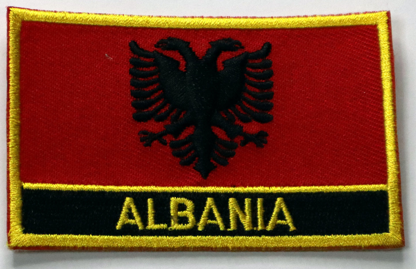 Albania Flag Iron On Patch. Great for attaching to your jackets, shirts, pants, jeans, hats. Size: 8x5cm