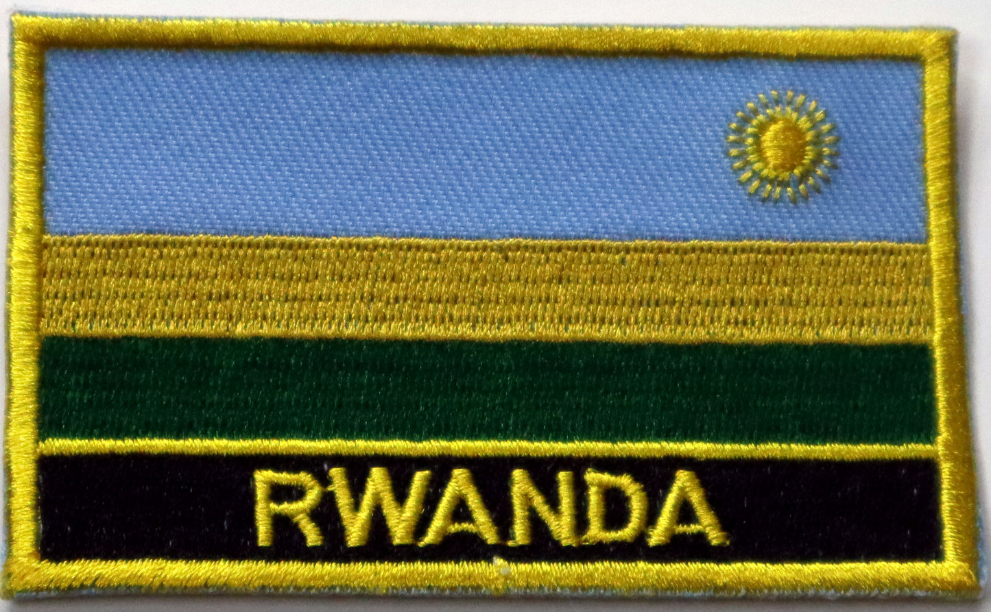 Rwanda Flag Iron On Patch. Great for attaching to your jackets, shirts, pants, jeans, hats. Size: 8x5cm