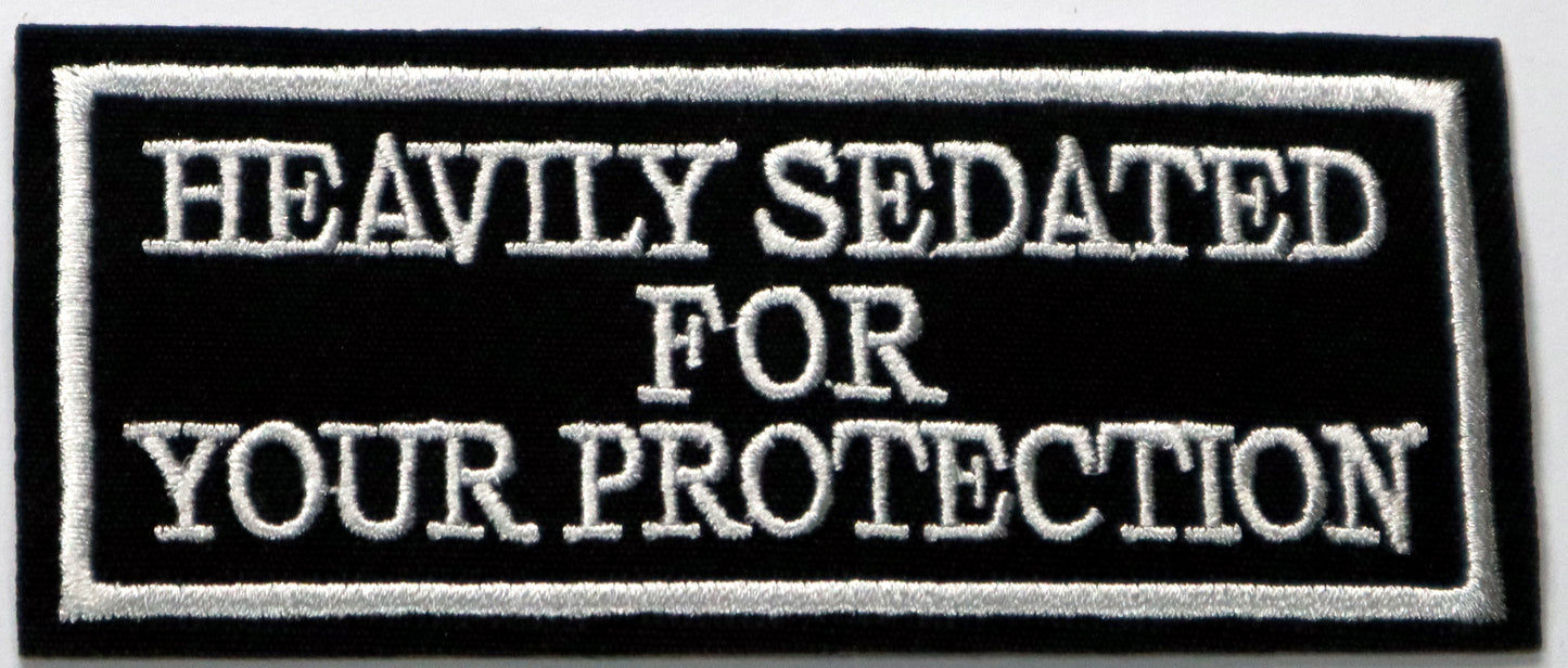 Heavily sedated for your protection Iron On Patch. Great for attaching to your jackets, shirts, pants, jeans, hats. Size: 9.8x4.2cm