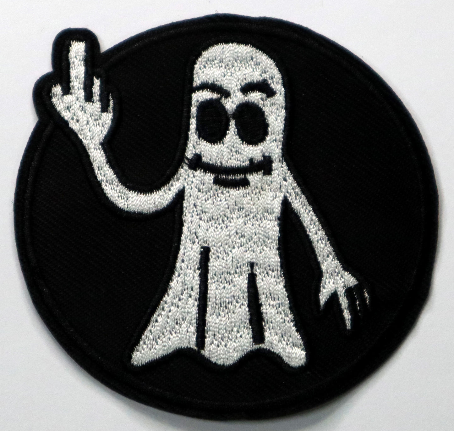 Ghost giving the finger Iron On Patch. Great for attaching to your jackets, shirts, pants, jeans, hats. Size: 7.8cm