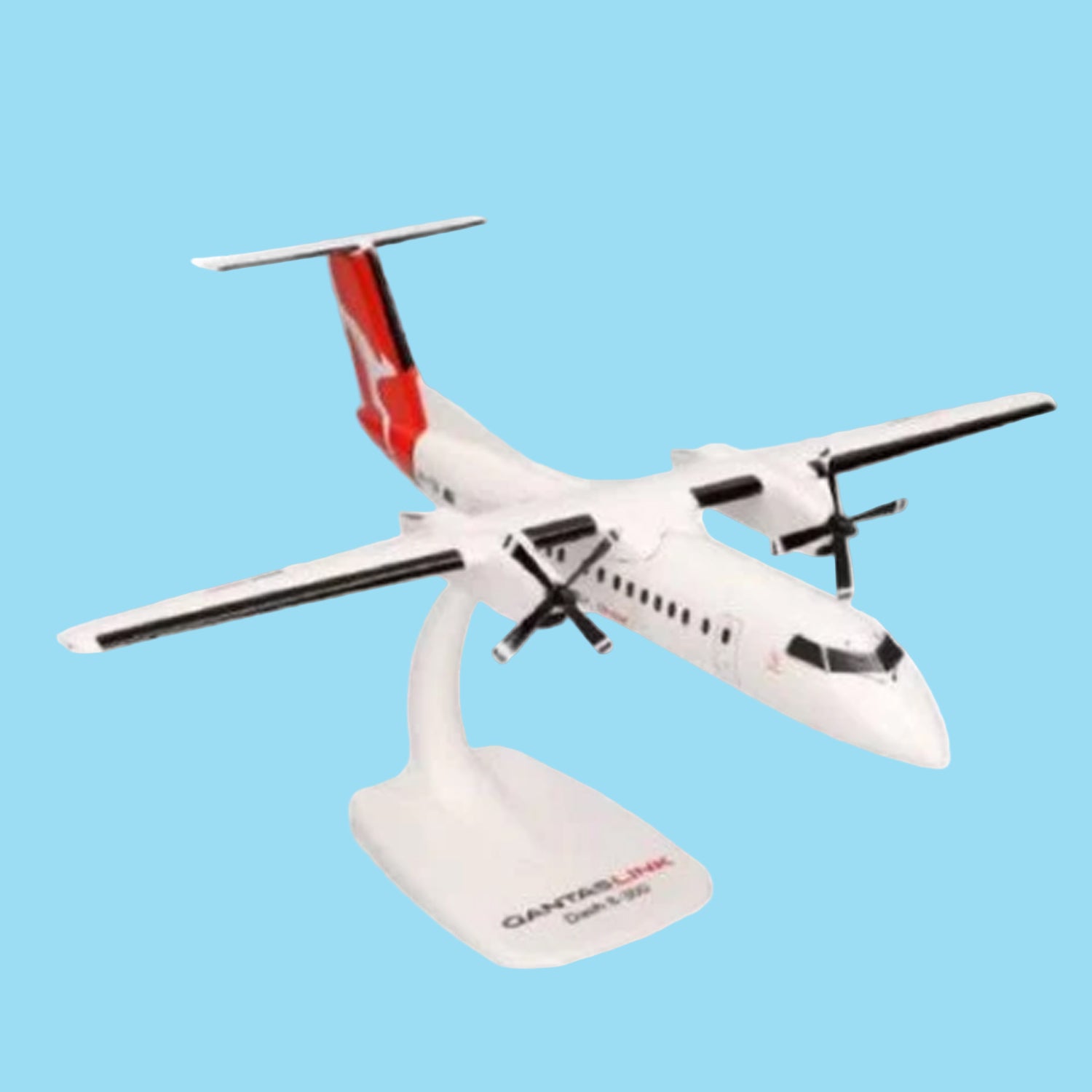 Celebrate regional aviation excellence with this charming 1/100 scale Dash 8-300 from PPC, featuring the QantasLink livery. This meticulously detailed collectible showcases the reliable turboprop that connects Australia's regional communities with style and efficiency. www.moralepatches.com.au