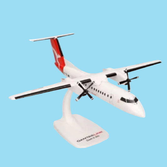 Celebrate regional aviation excellence with this charming 1/100 scale Dash 8-300 from PPC, featuring the QantasLink livery. This meticulously detailed collectible showcases the reliable turboprop that connects Australia's regional communities with style and efficiency. www.moralepatches.com.au