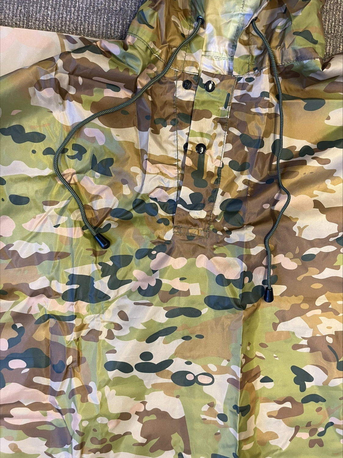 Stay protected from the elements with the Army Cadet Australian Multicam Poncho—your essential companion for any outdoor adventure. This versatile poncho shields you and your gear from heavy rain during camping, hiking, fishing, and military training. www.moralepatches.com.au