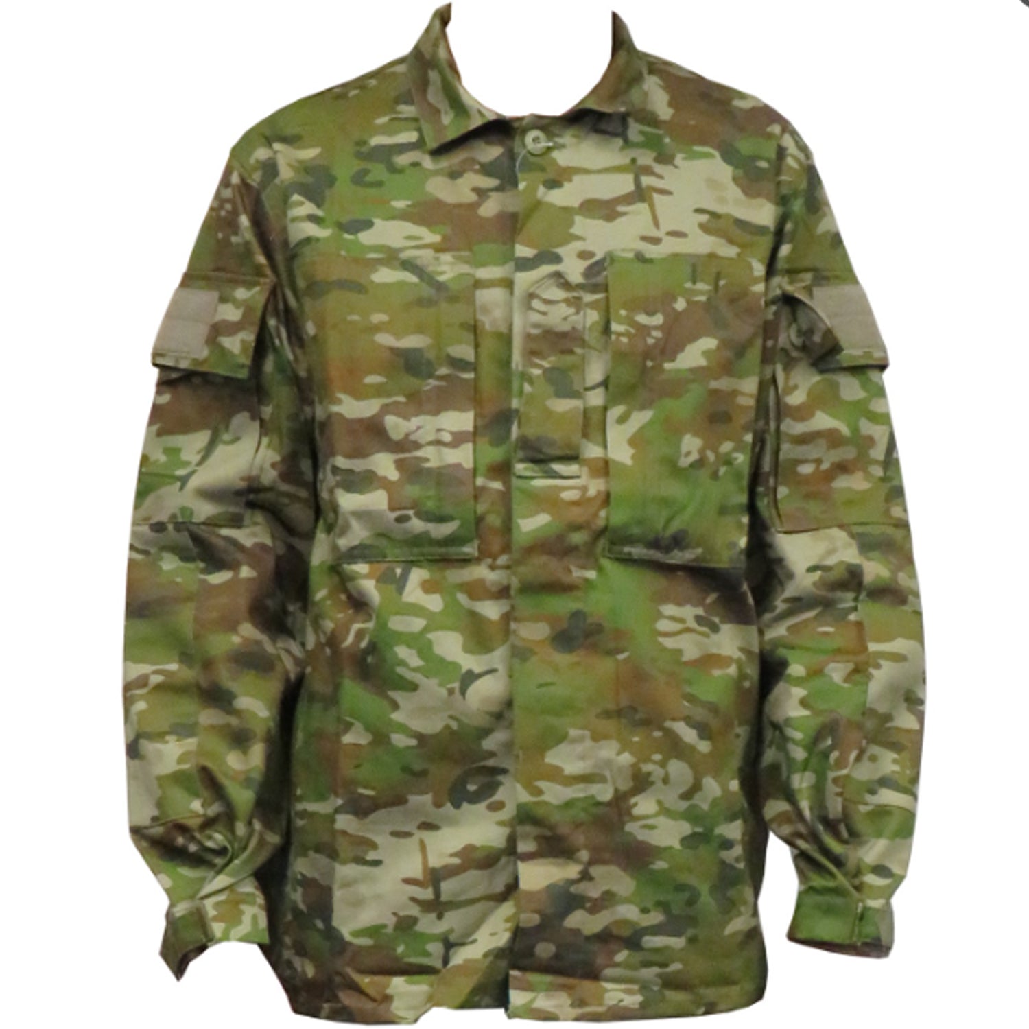 Built for demanding conditions, this TAS Long Sleeve Military Cadet shirt combines authentic Australian Army camouflage with practical performance features. The robust 70% cotton and 30% polyester blend delivers superior breathability without sacrificing durability, while the substantial 270GSM fabric stands up to rigorous wear. www.moralepatches.com.au