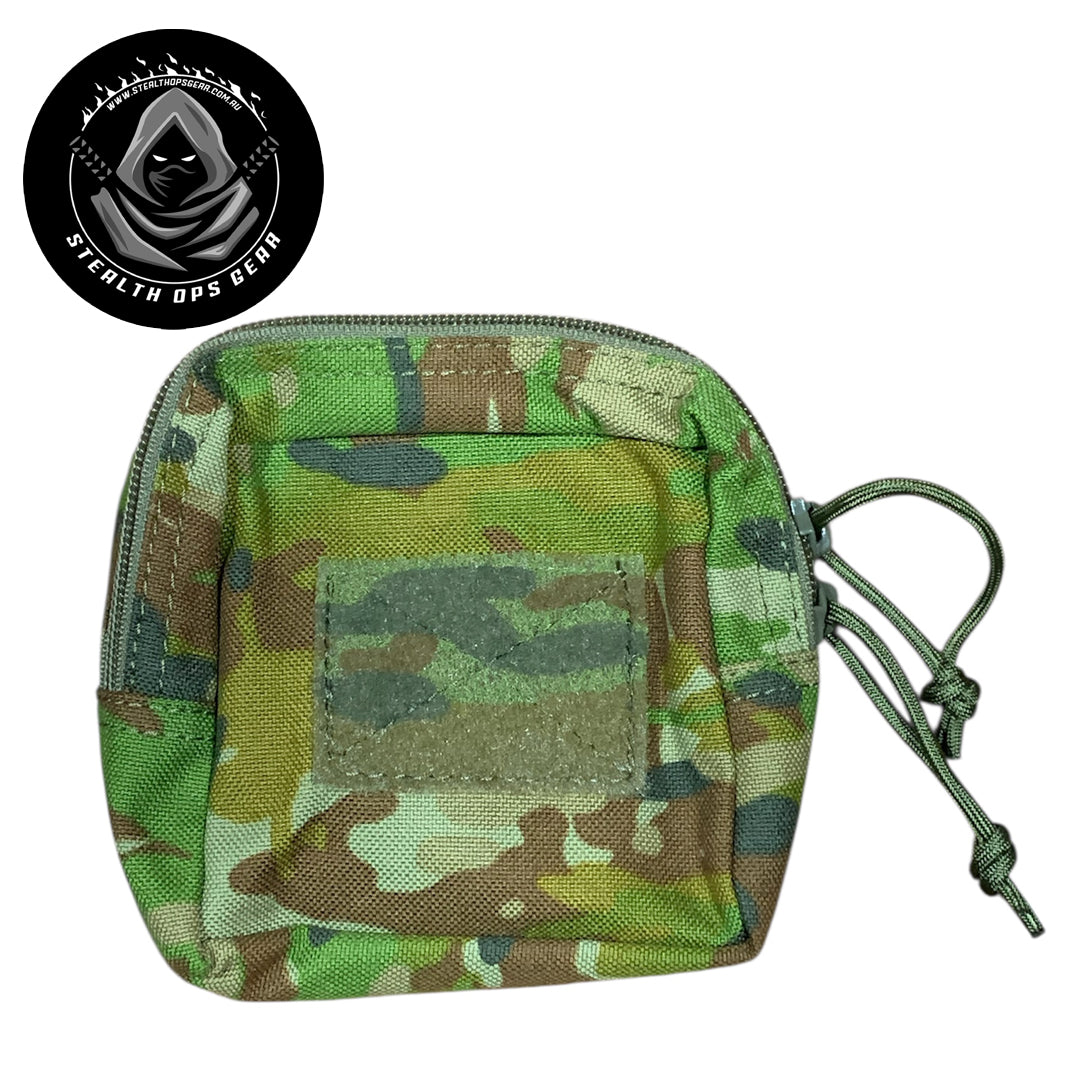 The AMCU Small Kit Pouch Stealth Ops Gear is an essential accessory for anyone needing quick access to small items without sacrificing space or comfort. Its compact dimensions of 12x11.5x6cm make it easy to attach to your belt, vest, or backpack without adding unnecessary bulk. www.moralepatches.com.au