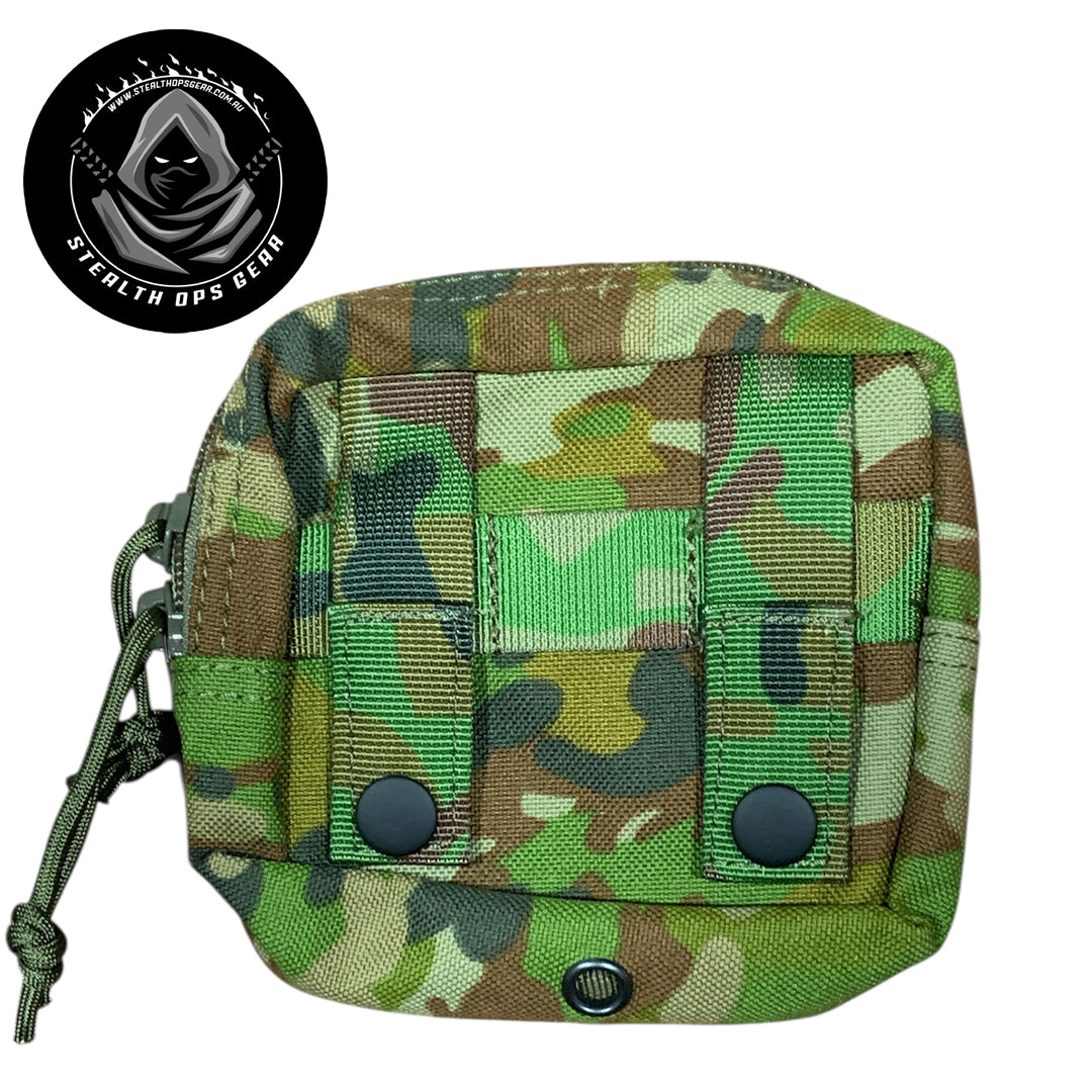 The AMCU Small Kit Pouch Stealth Ops Gear is an essential accessory for anyone needing quick access to small items without sacrificing space or comfort. Its compact dimensions of 12x11.5x6cm make it easy to attach to your belt, vest, or backpack without adding unnecessary bulk. www.moralepatches.com.au