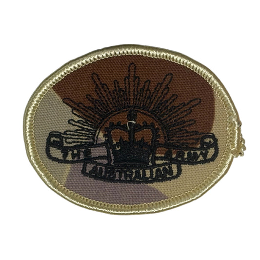 This DPDU Australian Army Rising Sun Biscuit Shoulder Patch, sized at 6.5cm by 4.7cm, features a plain backing that ensures easy application on uniforms, providing a subtle yet authentic military touch. www.moralepatches.com.au