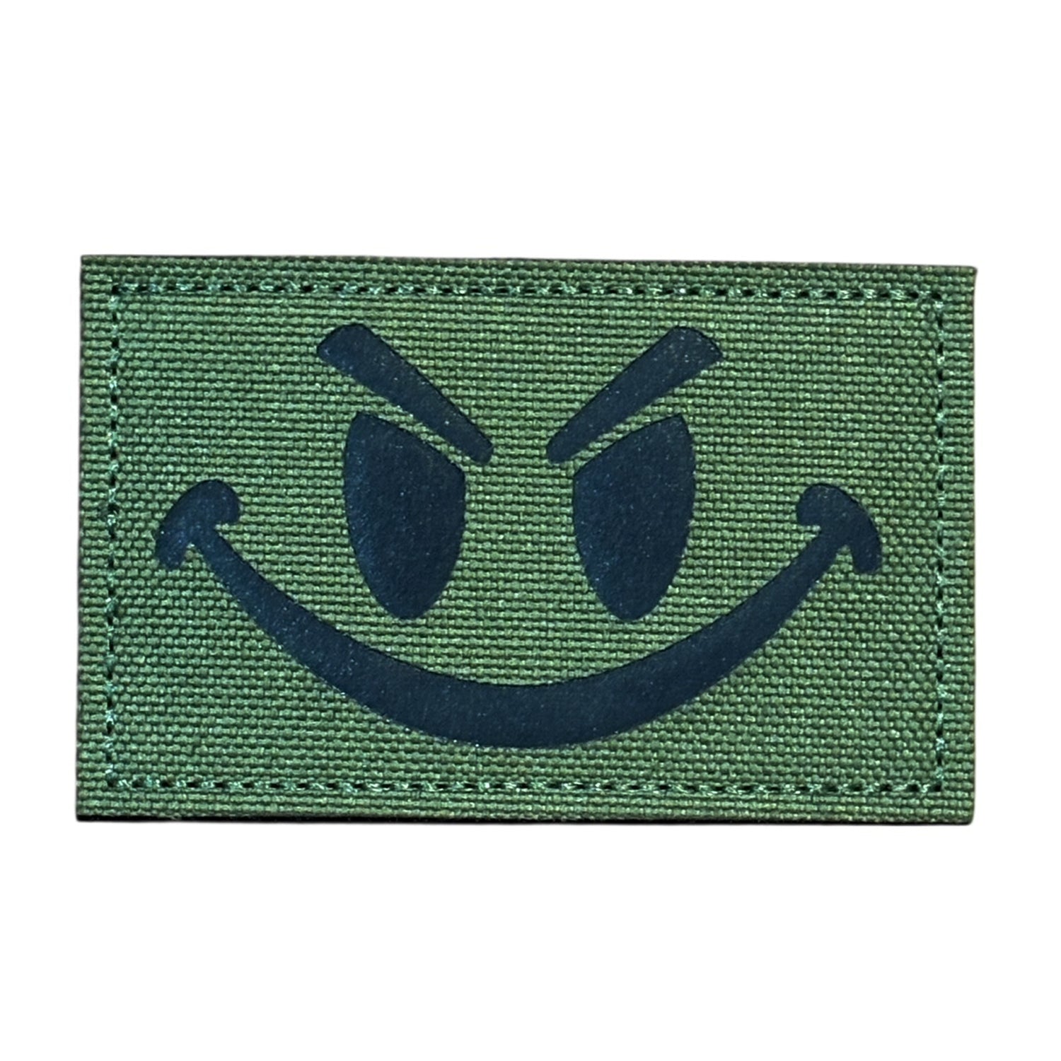 Make a bold statement with the Evil Smile Laser Cut Tan Patch. This striking 8x5cm patch features laser-cut precision detailing that demands attention. Backed with both hook and loop fasteners, it's ready to attach to tactical gear, backpacks, or uniforms instantly. www.moralepatches.com.au