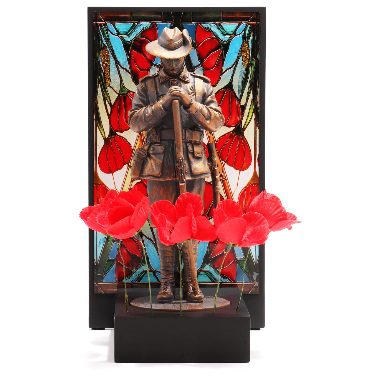 This beautifully crafted miniature figurine is a poignant tribute to our fallen soldiers. It comes with a striking acrylic backdrop, featuring an intricate stained-glass poppy design that adds depth and significance to the piece. www.moralepatches.com.au
