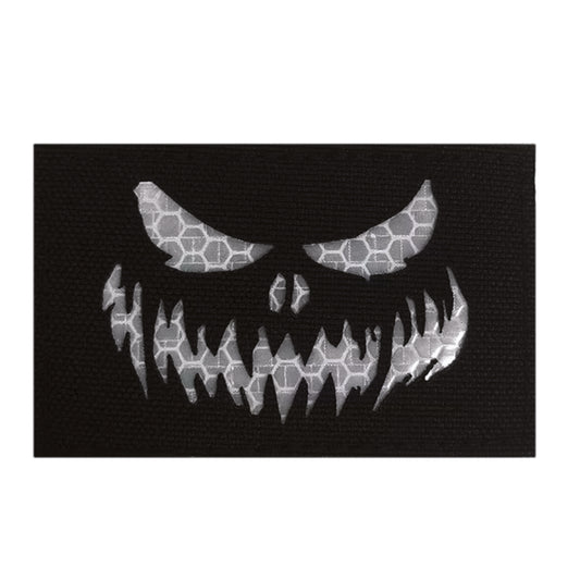 Stand out in low-light conditions with this striking Haunting Laser Cut Reflective Patch Hook &amp; Loop. Precision laser-cut design delivers crisp, detailed edges that catch the eye, while the reflective feature ensures visibility when it matters most.  www.moralepatches.com.au