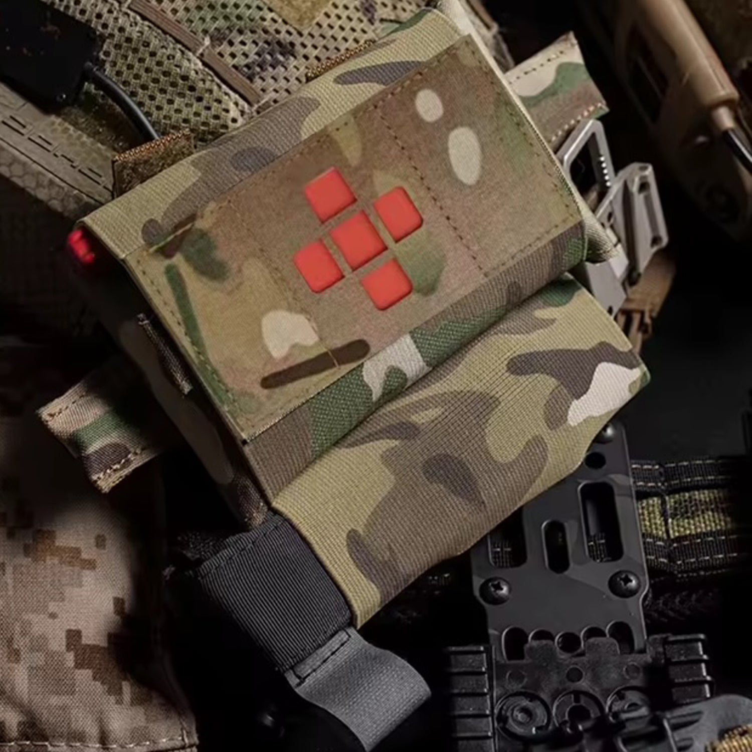 Compact yet comprehensive, this trauma first aid kit pouch combines tactical functionality with practical design. Weighing just 102 grams and measuring 22.5x10cm, it's engineered for rapid response without bulk. www.moralepatches.com.au