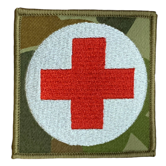 This Military Combat Patch, with the option of Plain or Velcro backing, is an essential for First Aid personnel in the field. Made from high-quality materials, this patch features an Australian-made field medical symbol and can easily be attached to First Aid Kits, Packs, or arm bands. Its exceptional quality is evident with overlocked edges and a size of 65mm x 65mm. Plus, it's proudly made in Australia using Auscam Fabric. www.moralepatches.com.au