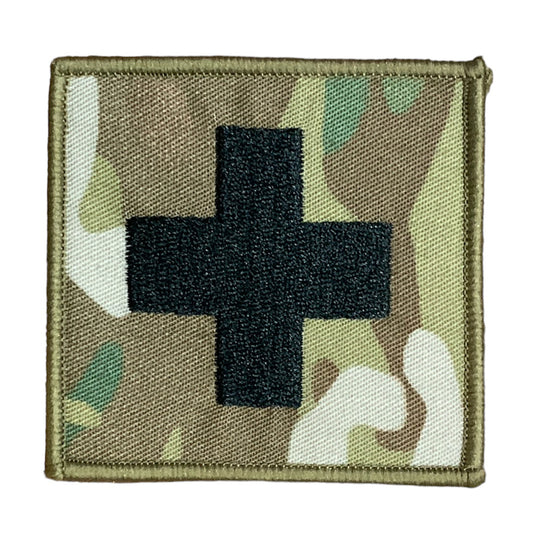 This Military Combat Patch, with the option of Plain or Velcro backing, is an essential for First Aid personnel in the field. Made from high-quality materials, this patch features an Australian-made field medical symbol and can easily be attached to First Aid Kits, Packs, or arm bands. Its exceptional quality is evident with overlocked edges and a size of 65mm x 65mm. Plus, it's proudly made in Australia using Multicam Fabric. www.moralepatches.com.au