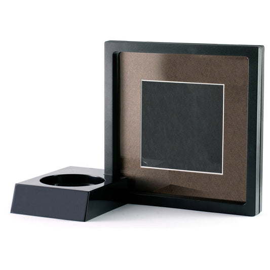 The display stand also accommodates a display frame to showcase photographs, souvenirs or mementos. The frame's contents are suspended between two flexible silicone membranes and appear to be 'levitating' in the frame. Hinges allow easy access to items when they need to be removed from the frame. www.moralepatches.com.au