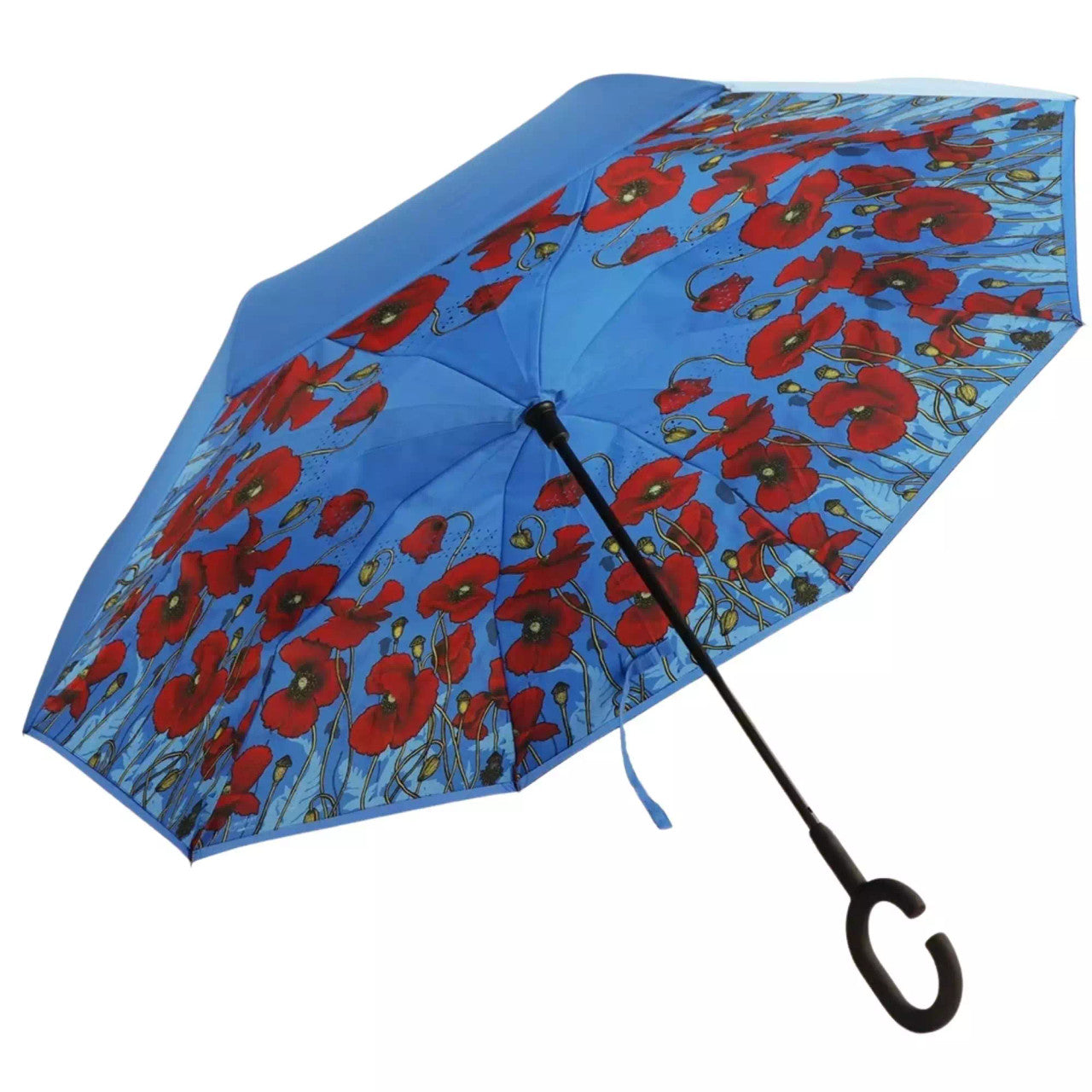 The windproof inverted umbrella featuring the stunning poppies artwork from the collection "Where the Poppies Grow" by Australian artist Adriana Seserko is a practical and stylish accessory for rainy days. This umbrella is designed to withstand strong winds and has a unique folding mechanism that keeps the wet part inside when folded. Stay dry and fashionable with this umbrella. www.moralepatches.com.au