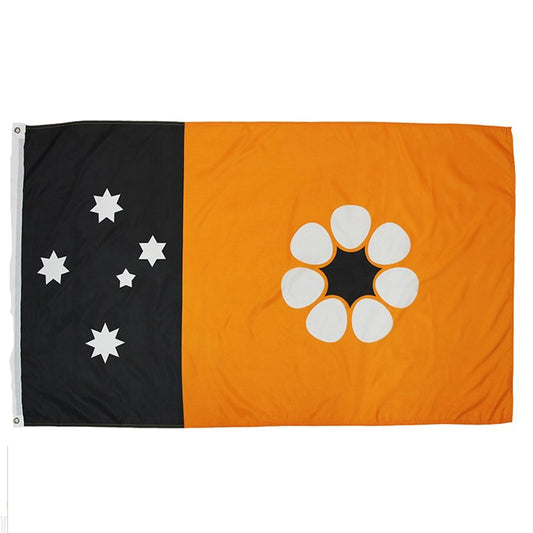 Adopted after self governance was granted on July 1st 1978, this flag consists of the Territorian colours of red, white and ochre. The Southern Cross appears as five white panels stars on a black panel at the hoist, while ochre fills the remainder of the flag. Set on the ochre backdrop in the fly is a Sturts Desert rose www.moralepatches.com.au