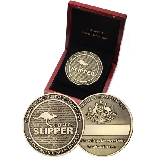 Marvel at the exquisite Operation Slipper 85mm Medallion in Timber Box! Its solid brass design, complete with integrated engraving plate, offers the perfect opportunity to craft unique personalisation, like deployment details, unit names, or special messages! www.moralepatches.com.au