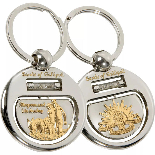 Experience the beauty and history of Gallipoli with our Sands of Gallipoli 07 Key Ring, featuring a sleek two-tone design and authentic sand from the famous beach. The sand flows freely in a cylindrical vial, creating a mesmerizing and meaningful piece. Each time you use your key ring, you'll be reminded of the significance of Gallipoli. www.moralepatches.com.au