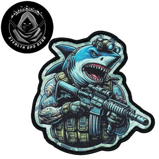 Unleash your creativity with the Shark Assault Embroidery Patch Hook &amp; Loop Stealth Ops Gear! Measuring 9x8.8cm and featuring a beautifully embroidered design and secure hook &amp; loop backing, this patch is a must-have for any collector. www.moralepatches.com.au