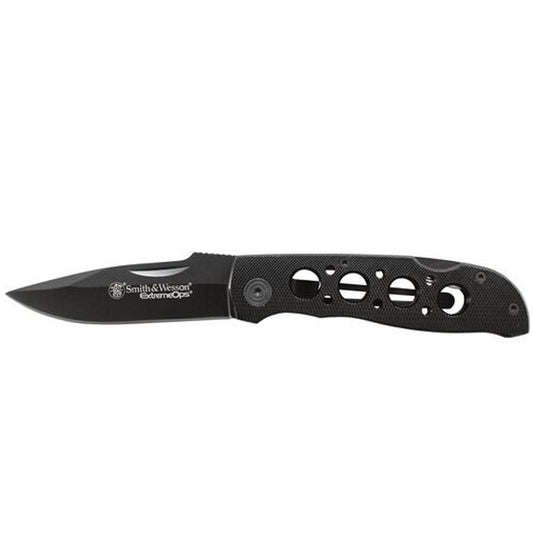 This Smith &amp; Wesson® Extreme Ops Liner Lock Drop Point Folding Knife features a black stainless-steel blade with nail pull and jimping and a black textured aluminum handle. The knife includes a pocket clip. www.moralepatches.com.au