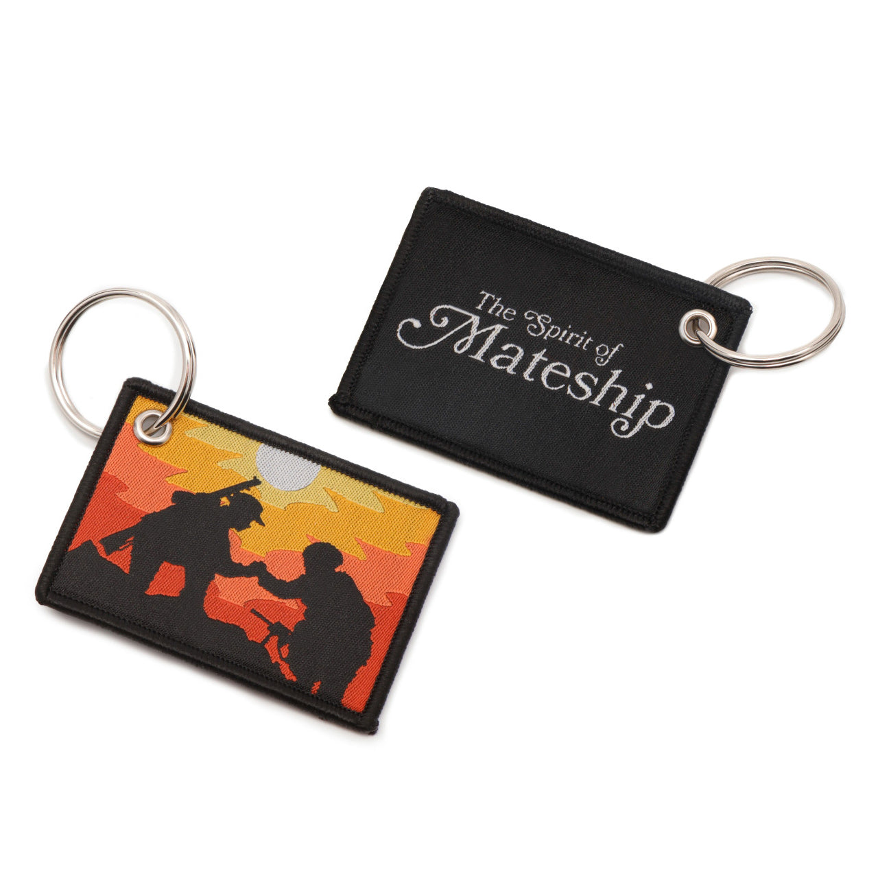 The front of the key tag features a striking image against the backdrop of a mesmerizing sunset. Here, you'll find a poignant silhouette: a WW1 digger extending a helping hand to a modern Australian soldier, both navigating a muddy battlefield. This symbolic representation speaks volumes about the unbreakable bond forged through adversity. www.moralepatches.com.au