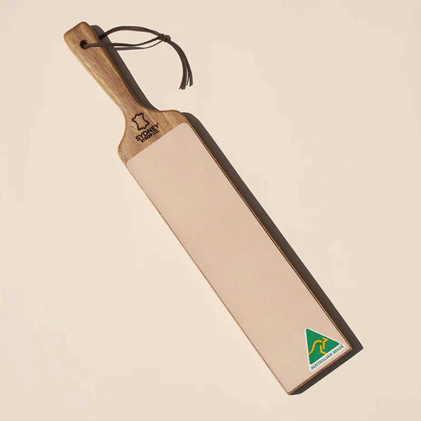 The paddle-style handle offers excellent grip and control, allowing for consistent, safe stropping. Ideal for straight razors, pocket knives, chisels, and woodworking tools, this strop efficiently removes burrs and enhances edge sharpness to a refined, mirror-like finish. www.moralepatches.com.au