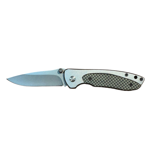 This Whitby Knife features a sleek aluminium handle with a striking carbon fibre effect, paired with a durable stainless steel blade measuring 6.35cm (2.5"). www.moralepatches.com.au