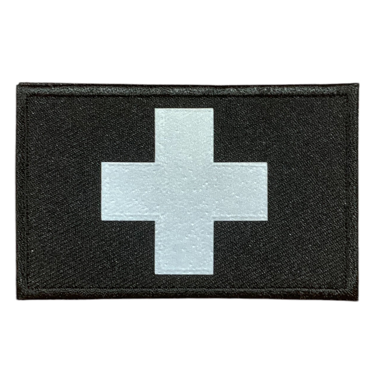 This Medic Reflective Laser Cut Patch is an essential addition to any gear collection! The durable hook and loop backing ensures easy attachment to any surface. Measuring at 8x5cm, this patch is the perfect size for visibility and practicality. Both the hook and loop pieces are provided, making application a breeze. Don't miss out on the value and versatility of this patch! www.moralepatches.com.au