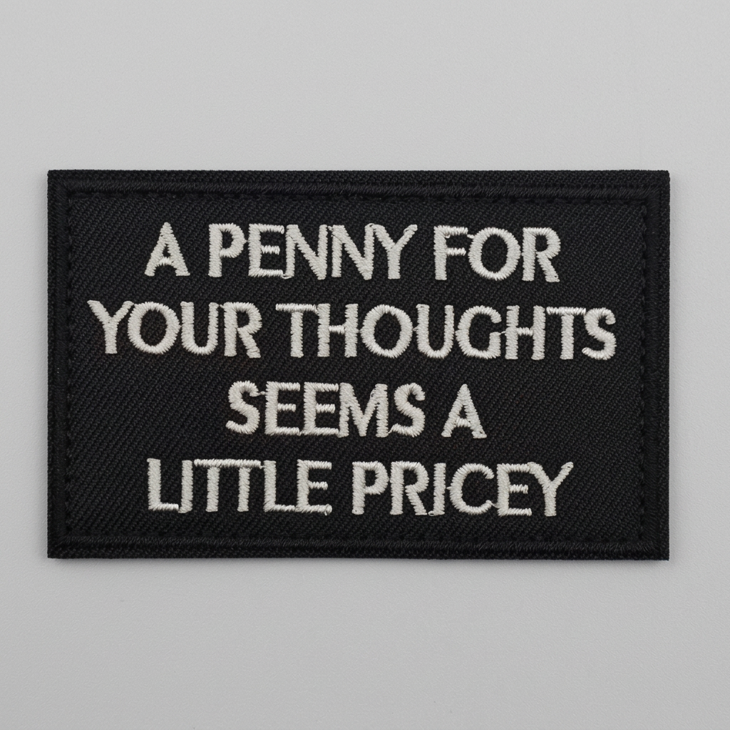 A Penny For Your Thoughts embroidered patch on a light grey background