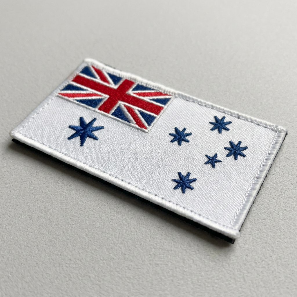 Angled detail of Navy White Ensign patch embroidery