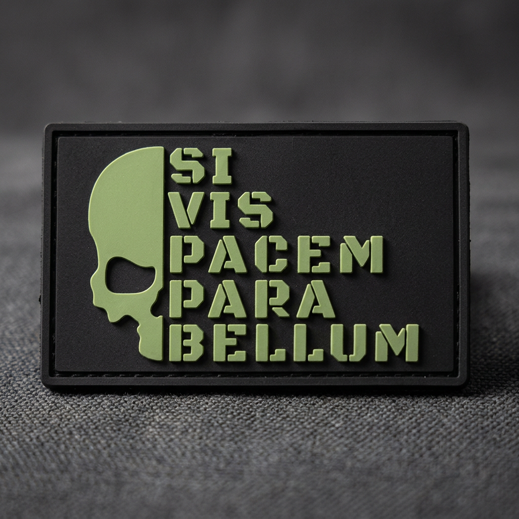 Close-up of black Para Bellum PVC patch on charcoal canvas