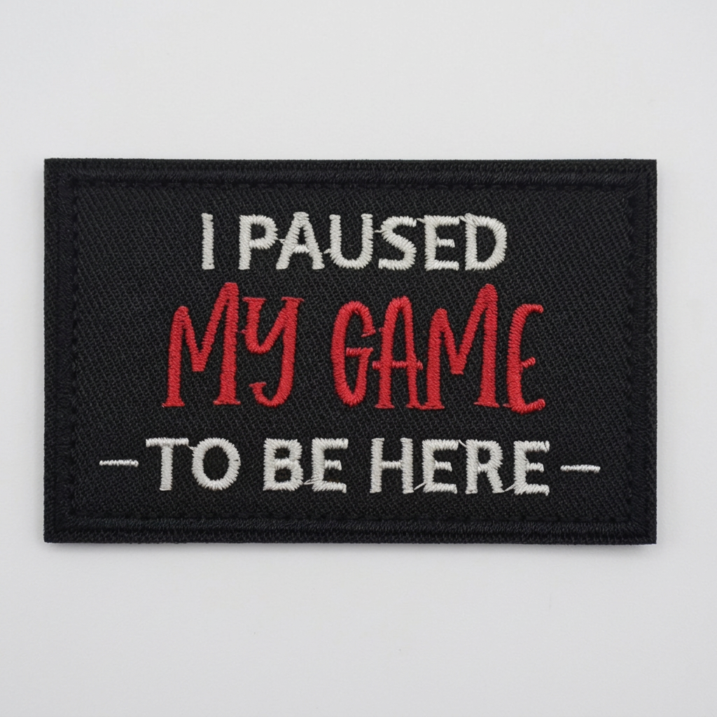 I Paused My Game To Be Here embroidered patch on light grey studio background