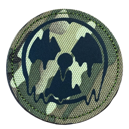 Make a bold statement with the Radioactive Meltdown Laser Cut Multicam Patch. This striking 8cm patch features laser-cut precision detailing that demands attention. Backed with both hook and loop fasteners, it's ready to attach to tactical gear, backpacks, or uniforms instantly. www.moralepatches.com.au