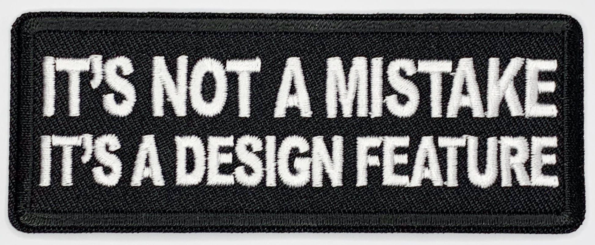 It's not a mistake, it's a design feature Iron On Patch. Great for attaching to your jackets, shirts, pants, jeans, hats.  Size: 10.4X4cm