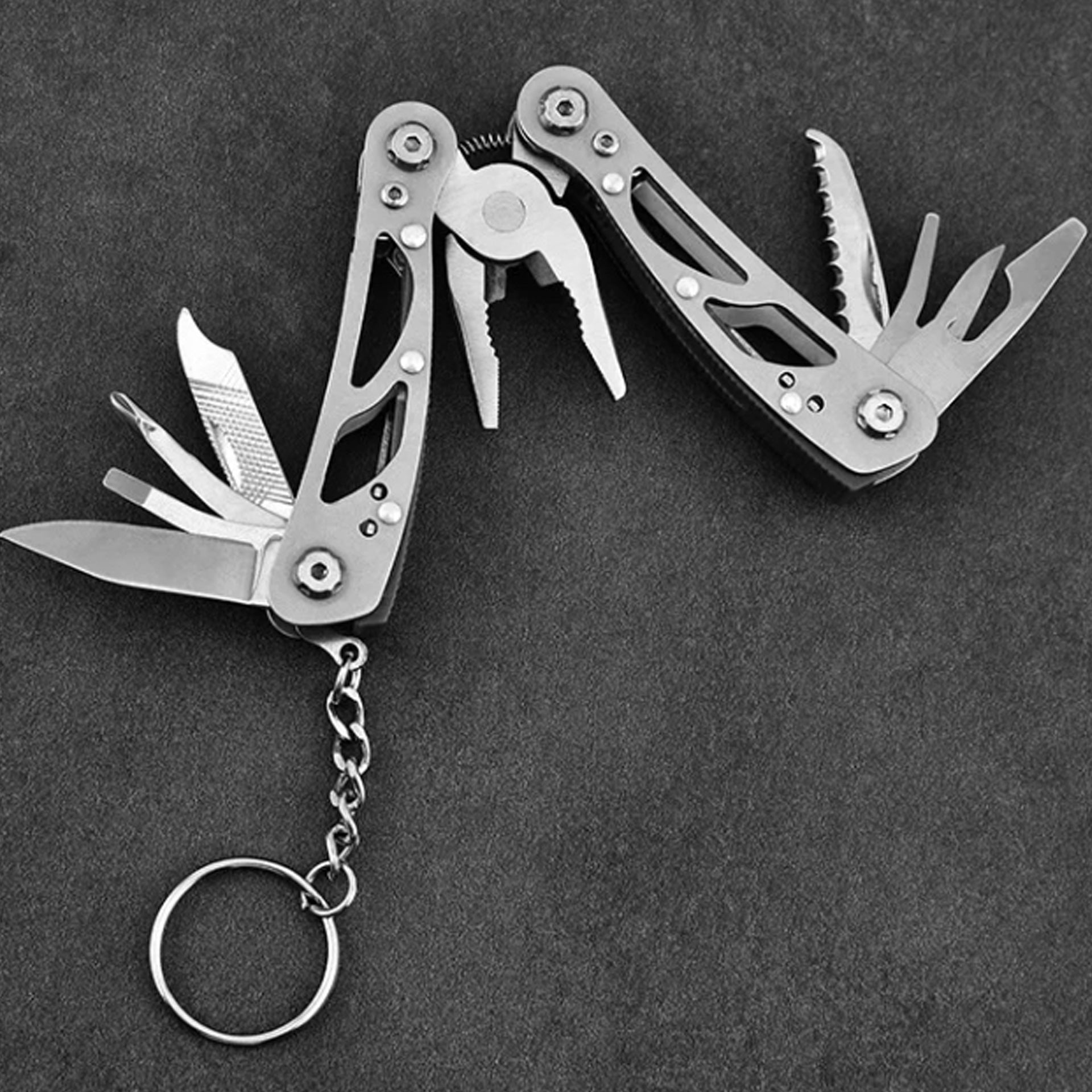 12 tools: pliers, wire cutters, large knife, small knife, cross & straight screwdriver, bottle opener, serration, vice, sharp scraper, nail file and Key ring. Compact folding design Pouch has belt loop www.moralepatches.com.au